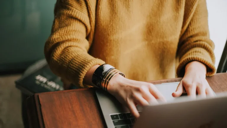 Person using a laptop on an accessible WordPress website