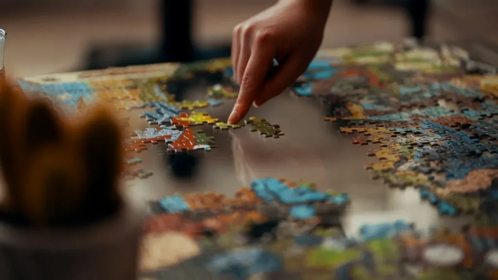 Hand holding a puzzle piece representing a custom WordPress plugin