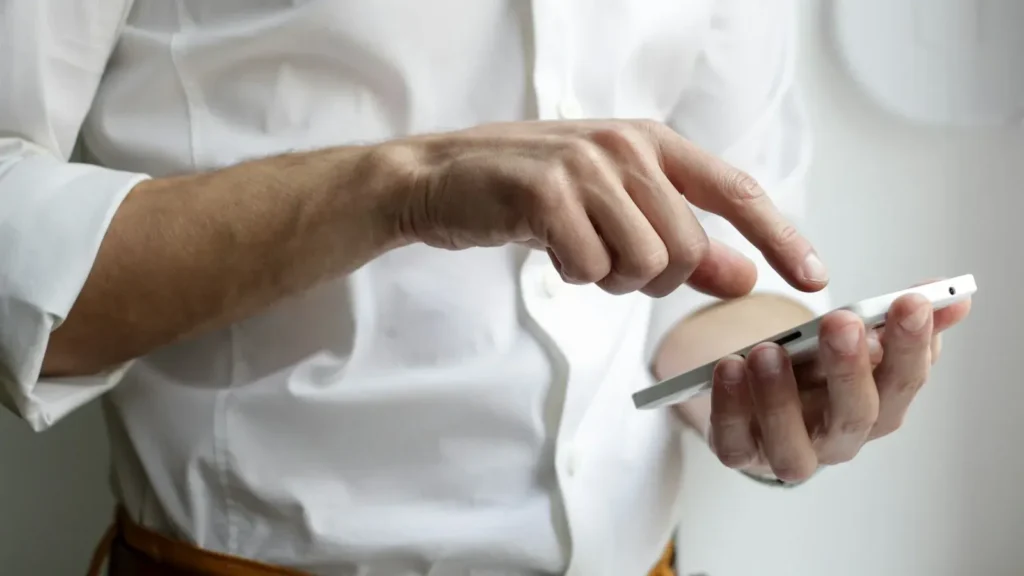 Person browsing a mobile-friendly website on a smartphone