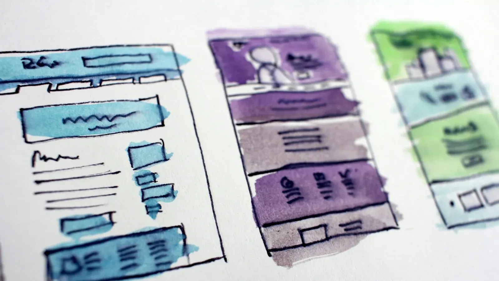 Website redesign wireframe sketches on paper