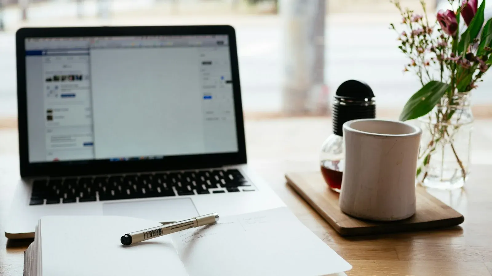 Laptop and notebook for an online course membership website